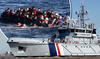 Pic 1 - immigrants with rescue boat